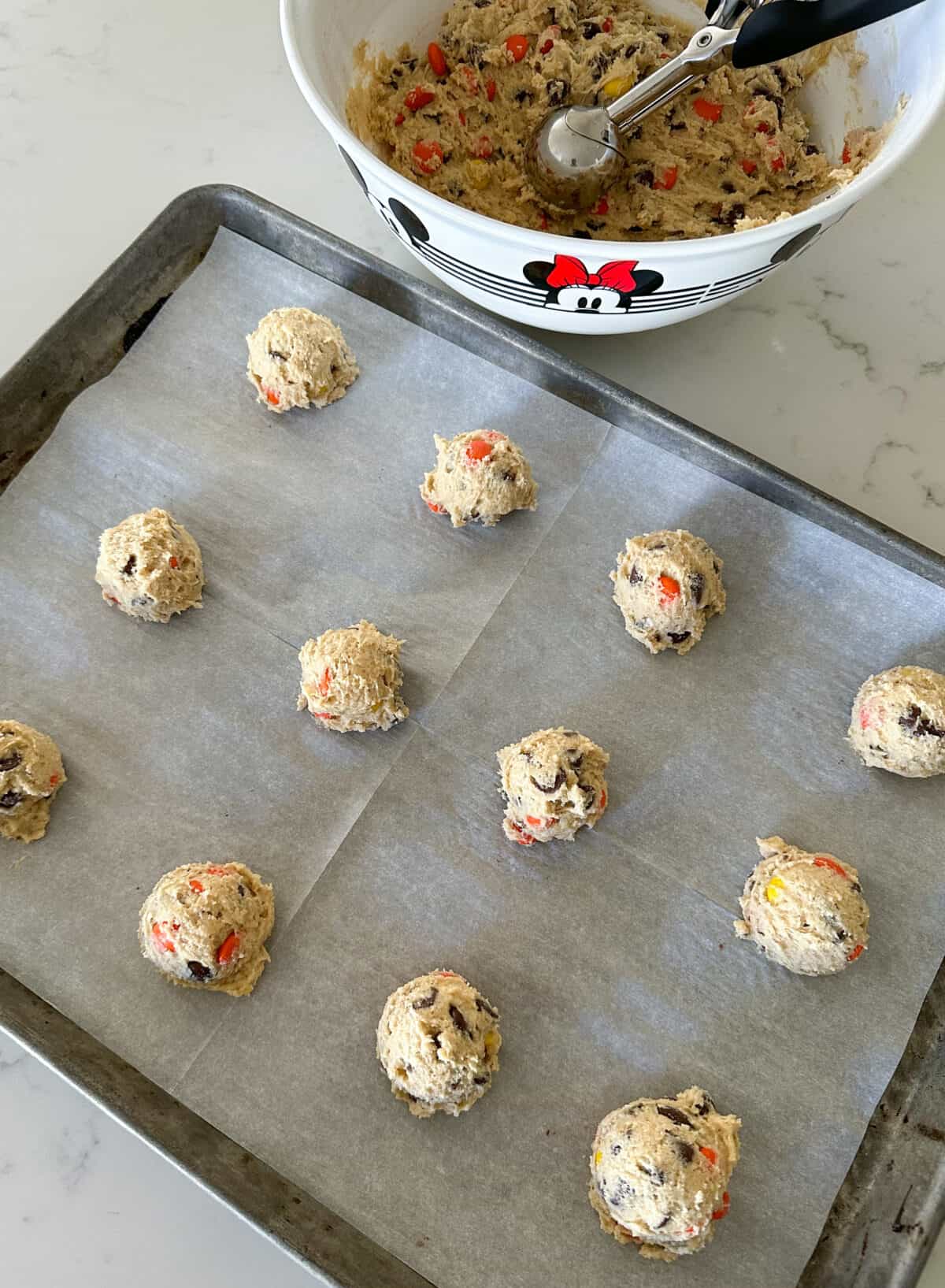 reese's pieces cookie dough on cookie sheet