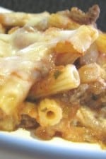 A serving of cheesy stuffed baked ziti on a white plate