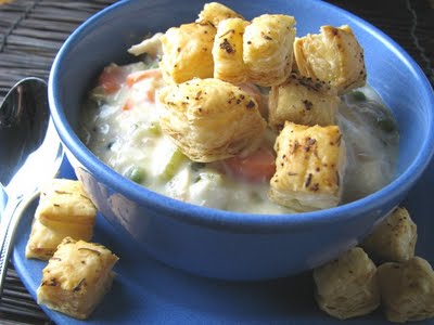 A creamy Chicken Pot Pie Bowl topped with light and flaky puff pastry croutons.