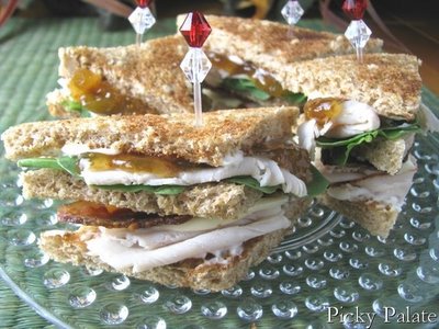A plate full of Turkey Club Sandwiches