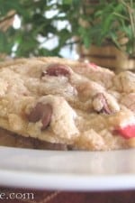 Cherry & Chocolate Chip Cookies on a platter with Christmas tree branches and ornaments in the background