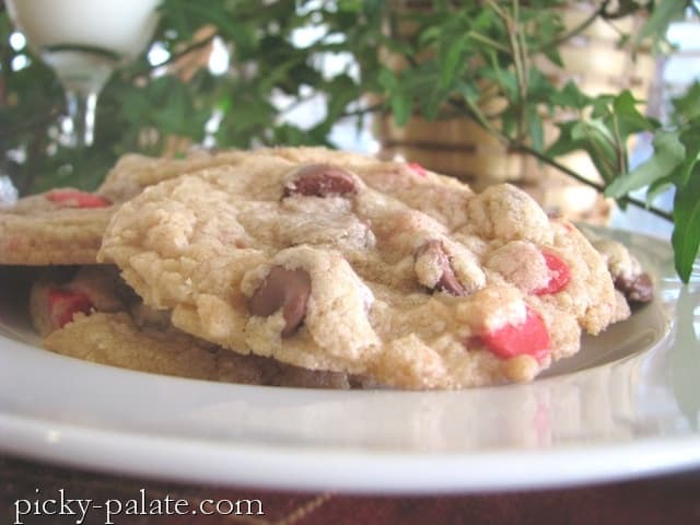Cherry & Chocolate Chip Cookies on a platter with Christmas tree branches and ornaments in the background