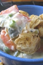 A bowl of Chicken Pot Pie Soup with Puffy Croutons