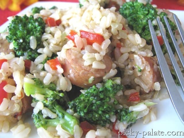 Chicken Sausage, Broccoli, Parmesan, and Brown Rice Dinner on a plate with a fork.