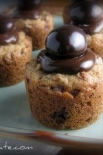 A few Chocolate Covered Cherry Cookie Cups Topped with a Chocolate Covered Cherry.