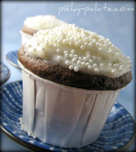 Two Homemade Chocolate Cupcakes with Cream Cheese Frosting and Non-Pareil Sprinkles on Top