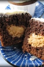 A Peanut Butter Filled Chocolate Cupcake Cut in Half to Show the Filling Inside