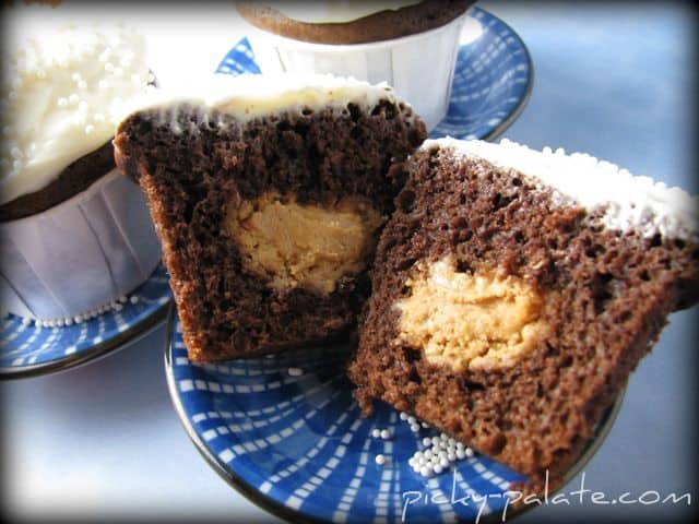 A Peanut Butter Filled Chocolate Cupcake Cut in Half to Show the Filling Inside