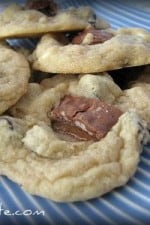 A platter full of Double Chipped Cookies with 100 Grand Bar pieces in the center.