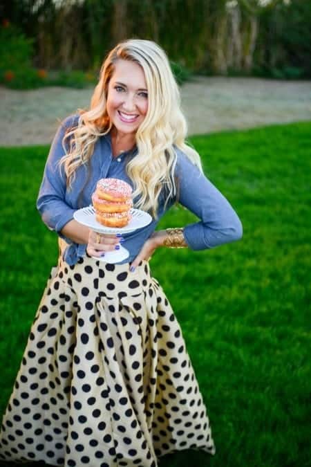 Jenny Holding a Stack of Doughnuts