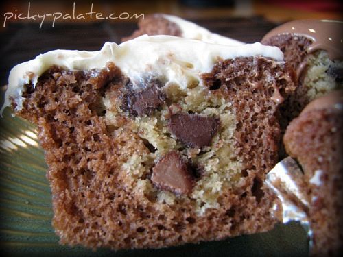 A Chocolate Chip Cookie Stuffed Cupcake cut in half.