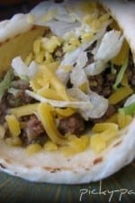A Crockpot Beef Taco rolled up in a Soft Tortilla Bread