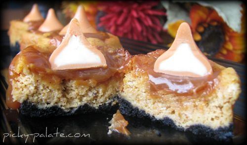 A Black Bottomed Mini Cheesecake Cut in Half and Split Apart to Show the Inside