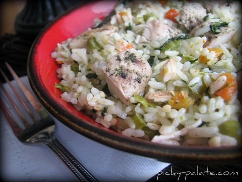 Plate of Romano ranch chicken and rice with vegetables.