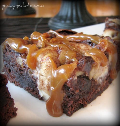 Cream cheese brownie topped with roasted apples and caramel sauce.