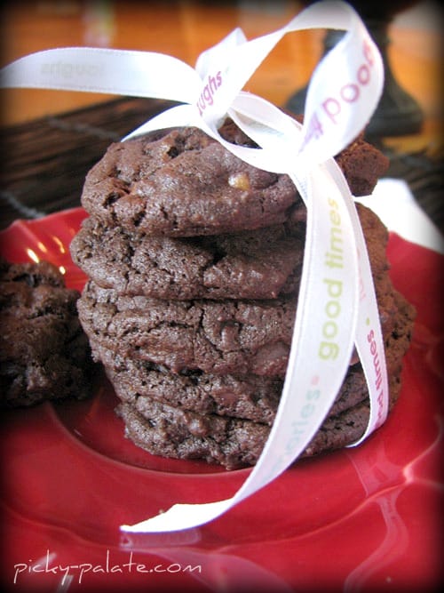 A stack of Chocolate Fudge Butterfinger Cookies wrapped in a ribbon.