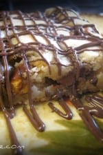 A Crunchy Reese's Cookie Bar topped with drizzled melted chocolate.
