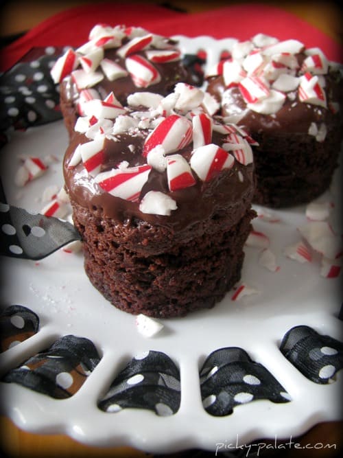 Three Candy Cane Kiss Centered Brownie Bites on a plate.