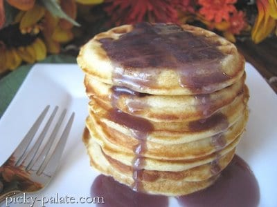 A stack of Silverdollar Waffle Pancakes with Blackberry Syrup