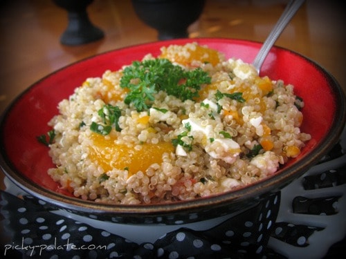 Bowl of mandarin quinoa salad with balsamic dressing.