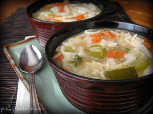 Two bowls full of Chunky Chicken Noodle and Vegetable Soup