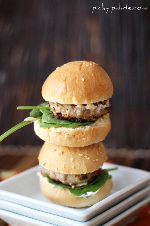 Two Turkey Burger sliders stacked on a plate.