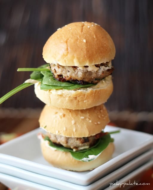 Two Turkey Burger sliders stacked on a plate.