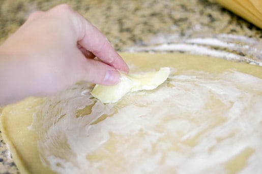 spread softened butter over cookie dough