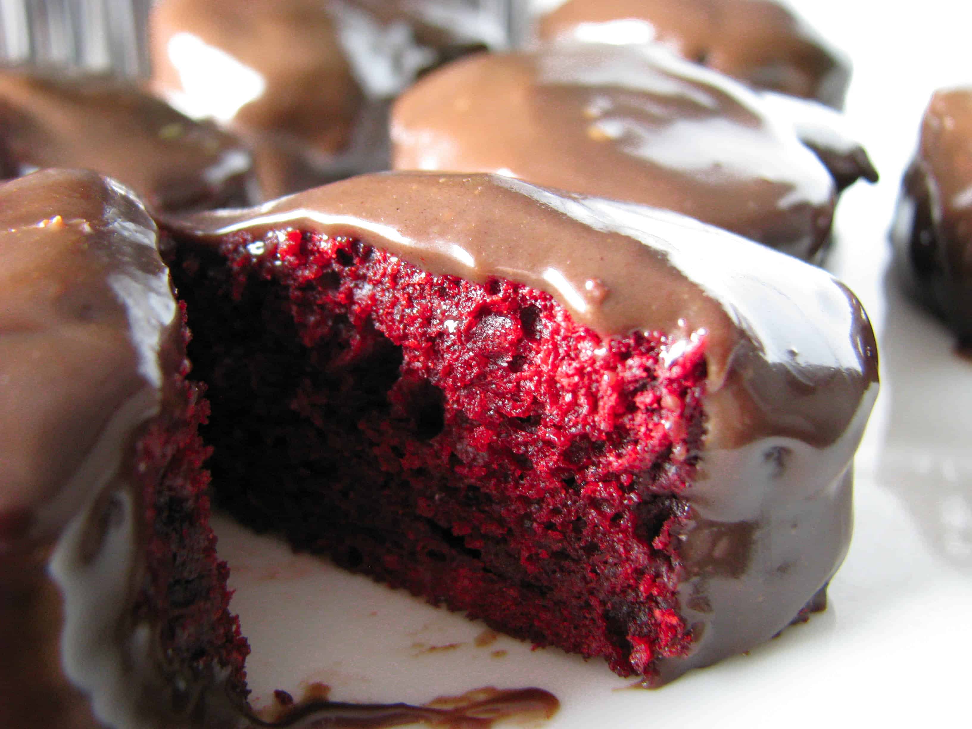 Red velvet heartcakes drenched in chocolate.
