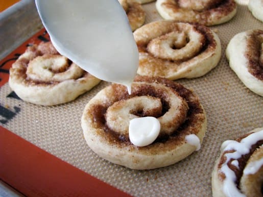 frost Cinnamon Roll Sugar Cookies with cream cheese frosting