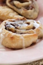 Roasted Banana Cinnamon Rolls on a plate with icing.