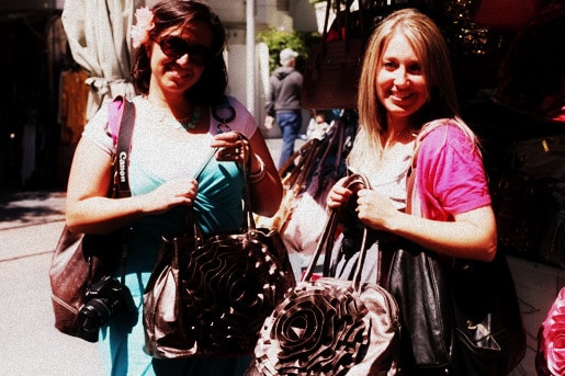 Mandy and Jenny Holding Handbags from the Kiosk