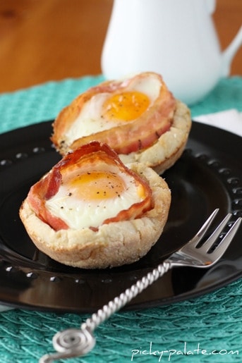 Two Egg McMuffin Cups on a Black Plate