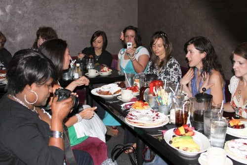 A Table Full of People and Food at The Griddle Cafe