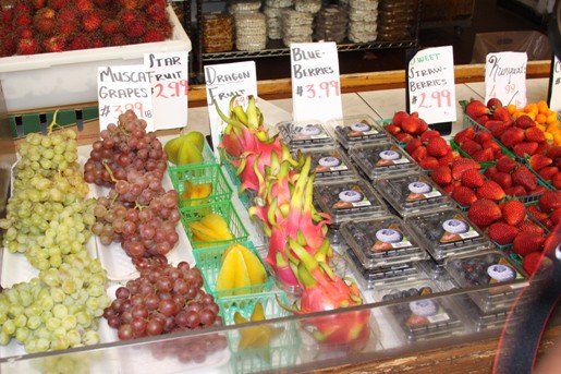 A Fruit Stand with Grapes, Strawberries and More at the Los Angeles Farmer's Market