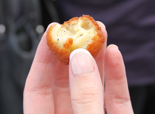 A Fried Mac and Cheese Ball with a Bite Taken Out of it