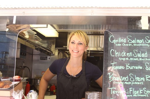 Head Chef Andi Through the Window of the World Fare Food Truck