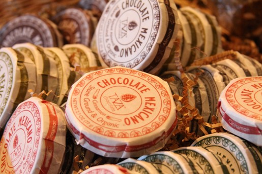 A Shelf Full of Large, Round Packaged Chocolates from Mexico