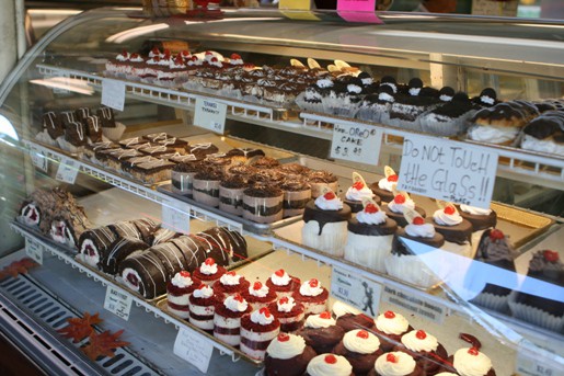 A Dessert Display Filled with Cupcakes, Trifles and Other Treats