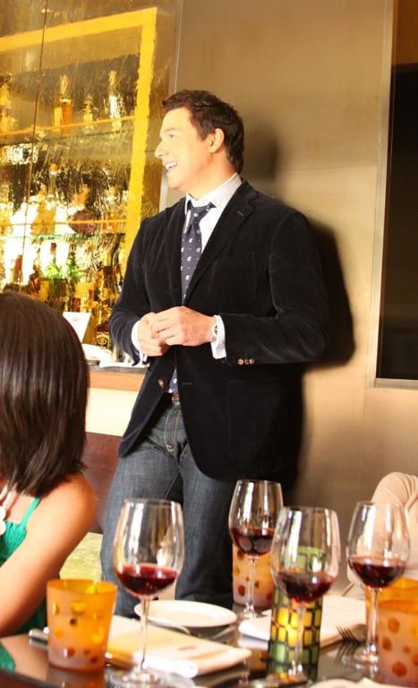 Rocco DiSpirito Leaning Against a Wall in the Culina Restaurant