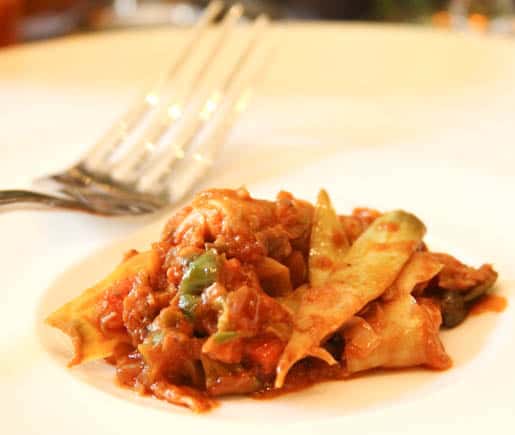 Baby Artichokes on an Off White Plate with a Fork