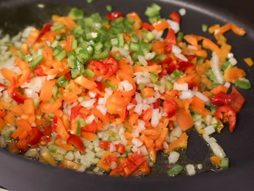 Veggies sauteed in a skillet.