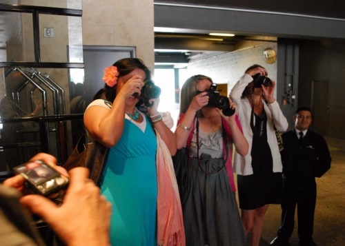 Three Women Snapping Pictures with Digital Cameras