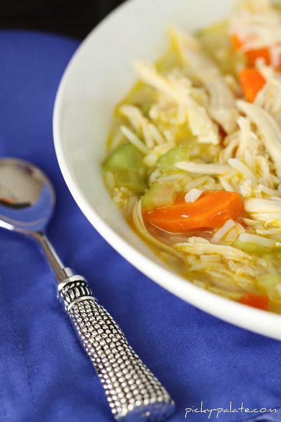 A bowl of Ranch Chicken and Rice Soup with a spoon.