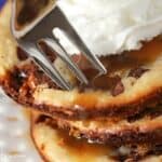 Snickers Caramel Cheesecake Cookies in a stack on a plate