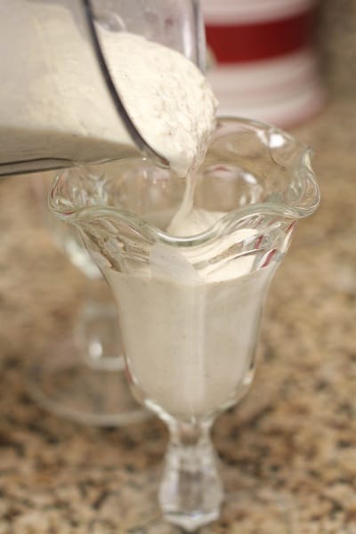 Pouring my Banana Bread Milkshake into a Glass