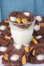 Chocolate Cake Smores Cookies surrounding a glass of milk
