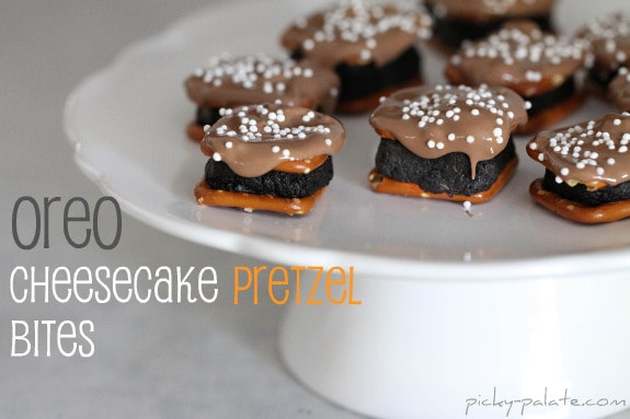 Oreo Cheesecake Pretzel Bites on a cake stand.