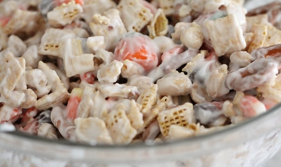 Vanilla candy-coated Mummy Munch Halloween Chex mix in a bowl.