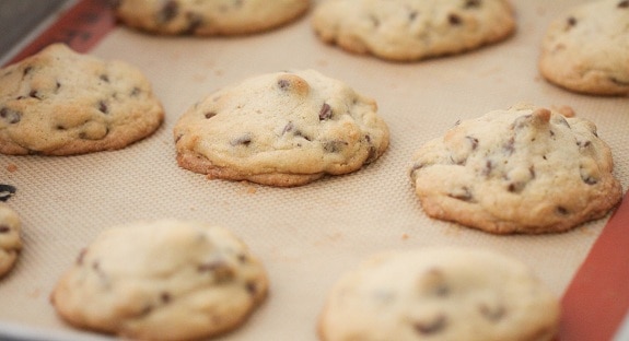 Oreo truffle surprise cookies laid out on a baking mat.